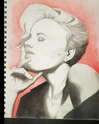 Depicts a bust shot of woman with short hair resting her chin on her right hand. Materials used: charcoal pencil, red pastel pencil, graphite pencil.